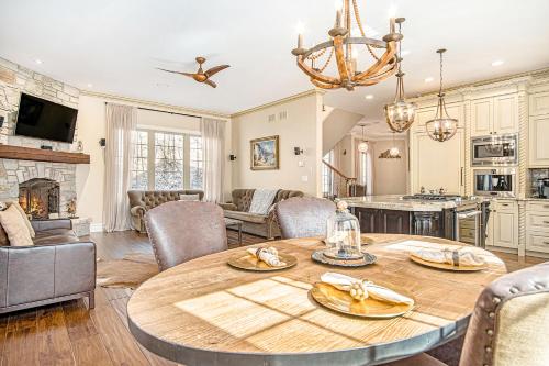 a kitchen and living room with a table and chairs at Eagles Nest in New Buffalo