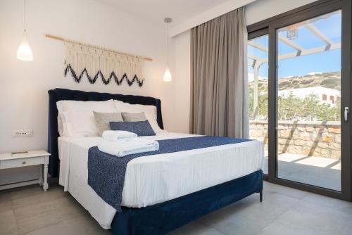 Posteľ alebo postele v izbe v ubytovaní Askelinos Villas