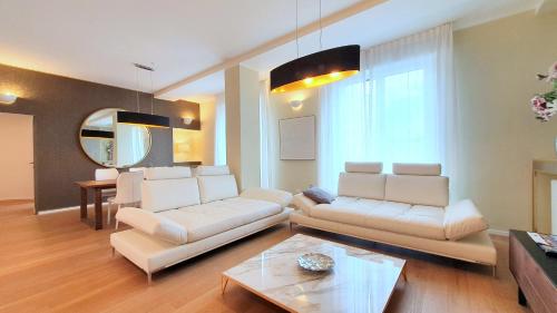a living room filled with furniture and a couch at Heart Milan Apartments San Sepolcro Duomo in Milan