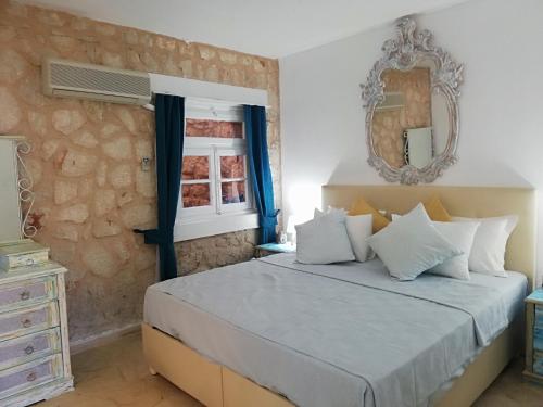 Кровать или кровати в номере Sea view Bougainvillea 52