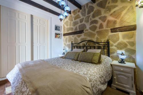 Postel nebo postele na pokoji v ubytování Casa Nazarí - Setenil de las Bodegas