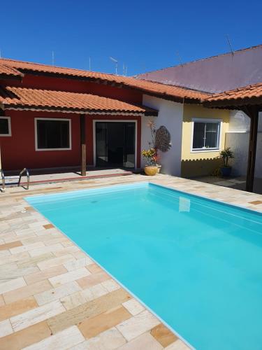 The swimming pool at or close to Casa Praia Itanhaém