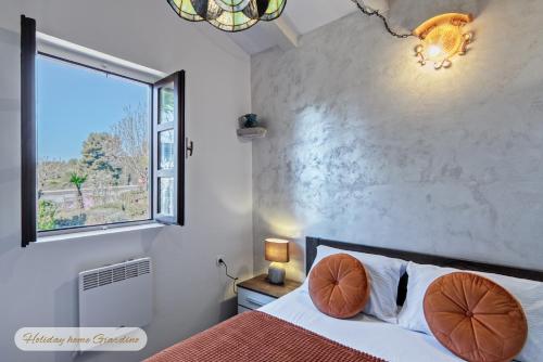 Katil atau katil-katil dalam bilik di Holiday Home Giardino Marino
