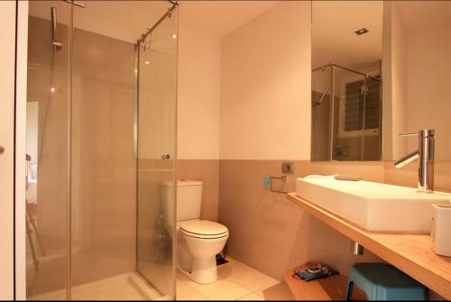 a bathroom with a shower and a toilet and a sink at Laureli in Tazacorte