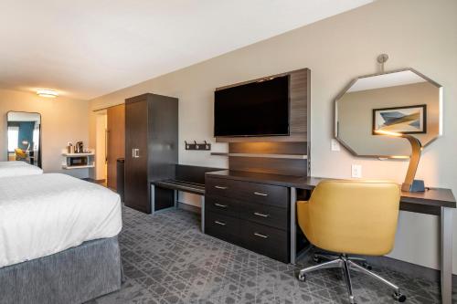 a hotel room with a bed and a desk and a television at Holiday Inn Express & Suites - Carlisle Southwest I-81, an IHG Hotel in Carlisle