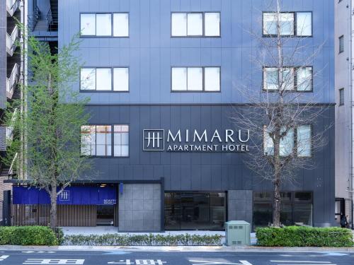 um edifício com uma placa na frente dele em MIMARU TOKYO ASAKUSA STATION em Tóquio