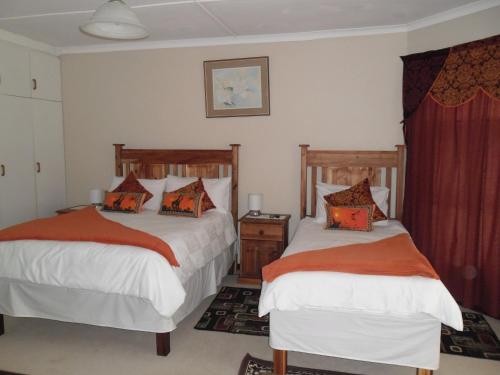 Säng eller sängar i ett rum på Reheifo Lodge