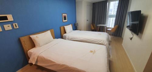 Llit o llits en una habitació de Hotel Bellia