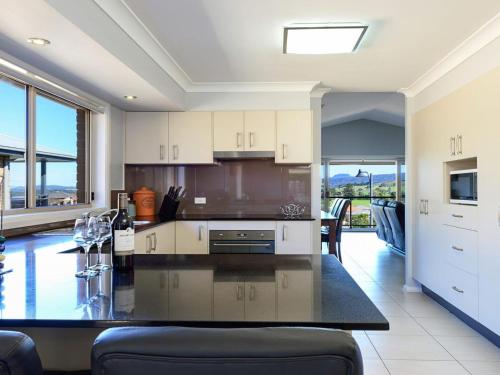 A kitchen or kitchenette at Sunset over Neptune - pet friendly, 5 min to beach