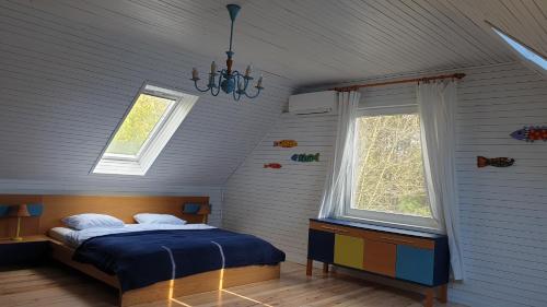 Ένα ή περισσότερα κρεβάτια σε δωμάτιο στο MiLa Home Balaton
