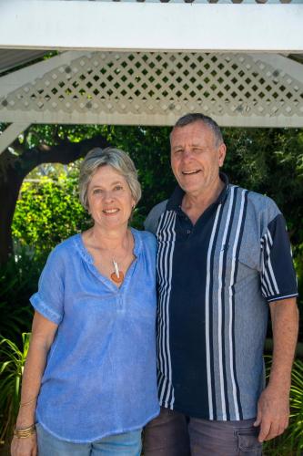 a man and a woman posing for a picture at Rosebridge House Bed & Breakfast Adult Retreat in Gooseberry Hill