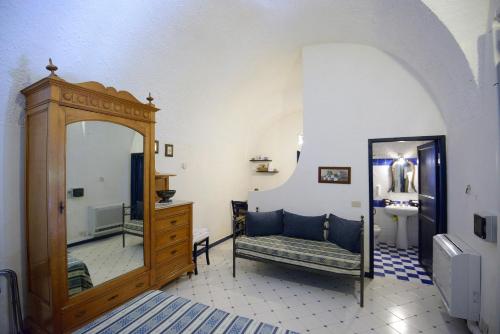 a bathroom with a mirror and a sink and a mirror at Duca di Castelmonte in Trapani