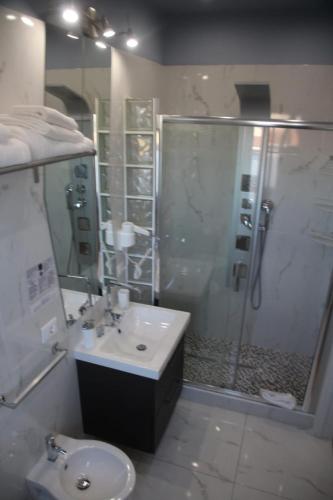 a bathroom with a shower and a sink and a toilet at B&B Pescara Centro Luxury Suite in Pescara