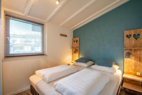 Postel nebo postele na pokoji v ubytování Garnekuul 56 - Callantsoog