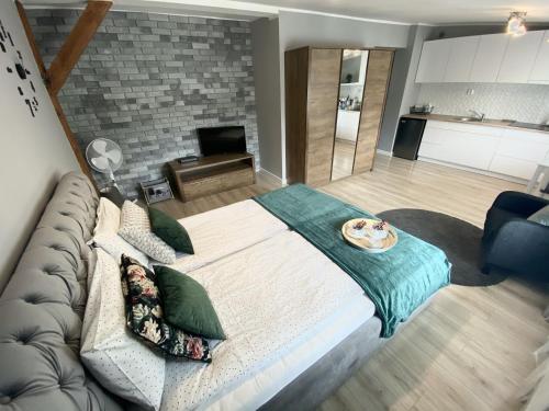 Ένα ή περισσότερα κρεβάτια σε δωμάτιο στο Apartament Blue Lagoon