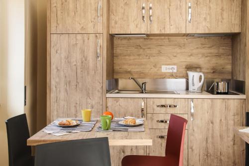 a kitchen with a table with food on it at Girastrittue Colobraro in Colobraro