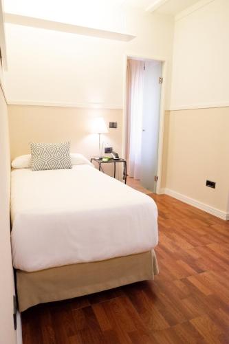Cama o camas de una habitación en U-Sense Sevilla Centro