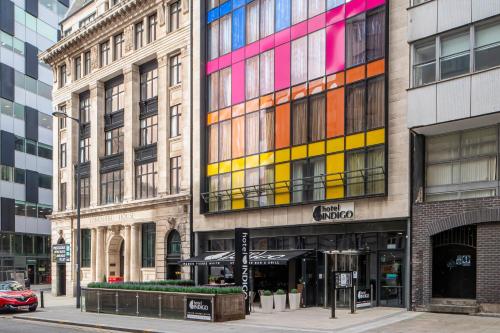 a building with colorful windows on a city street at Hotel Indigo Liverpool, an IHG Hotel in Liverpool