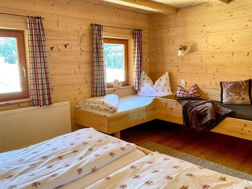 Cama ou camas em um quarto em Ferienhaus Tuxerhof