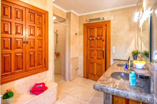 a bathroom with a sink and a shower at 0327 Villa El Cau in Jávea