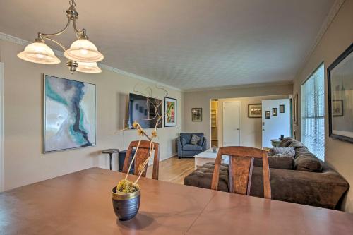 a living room with a table and chairs and a couch at 8 Mi to Lake Ray Hubbard Creekside Garland Home in Garland