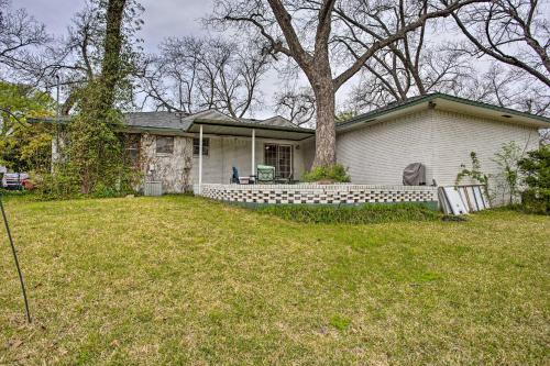 a white house with a tree in a yard at 8 Mi to Lake Ray Hubbard Creekside Garland Home in Garland