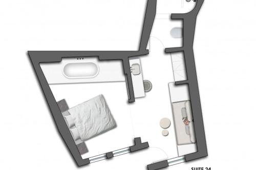 a floor plan of a room with a bed at Porto Fira Suites in Fira