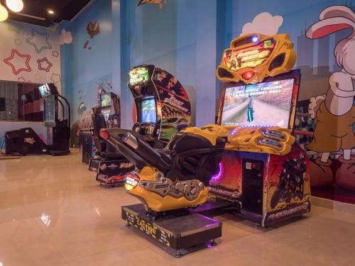 a room with two arcade games and a video game console at Serenity Alma Heights - Ex Serenity Fun City in Hurghada