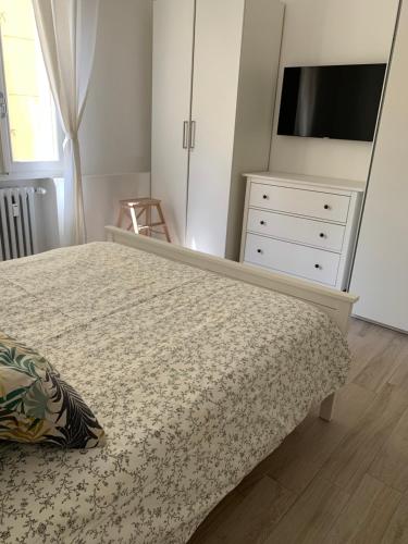 Un ou plusieurs lits dans un hébergement de l'établissement Verdi appartment