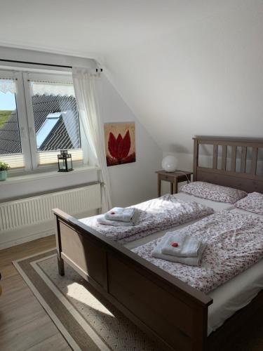Ліжко або ліжка в номері Ferienwohnungen am Aussendeich