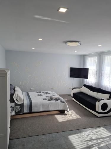 Katil atau katil-katil dalam bilik di Birutės apartamentai