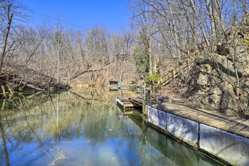 a body of water with a dock and trees at Pet-Friendly Cabin with Dock on Claytor Lake! in Radford