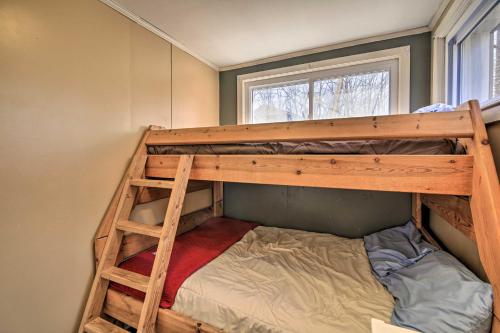 a bunk bed in a small room with a bunk bed in a house at Pet-Friendly Cabin with Dock on Claytor Lake! in Radford