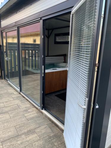 a room with sliding glass doors on a building at Filkes Rezidence in Filkeháza