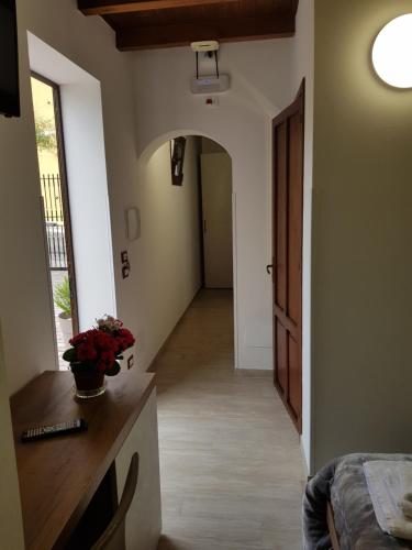 a hallway of a house with a room with a bed at Amaka in Custonaci
