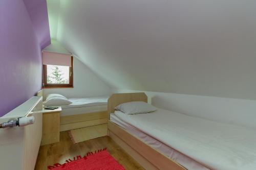 Cama ou camas em um quarto em Apartmani Nika