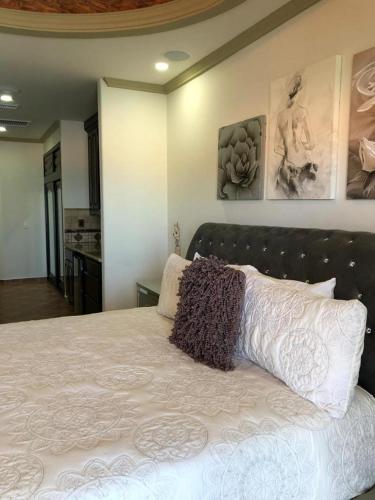 a bedroom with a large white bed with two pillows at ESMERALDA B-201 in Puerto Peñasco