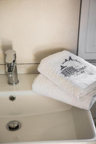 a towel sitting on top of a bathroom sink at Panorama Fanari studios and apartments in Argostoli