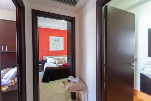 Ένα ή περισσότερα κρεβάτια σε δωμάτιο στο Residence Borgo & Mare - Localo