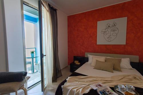 Ένα ή περισσότερα κρεβάτια σε δωμάτιο στο Residence Borgo & Mare - Localo