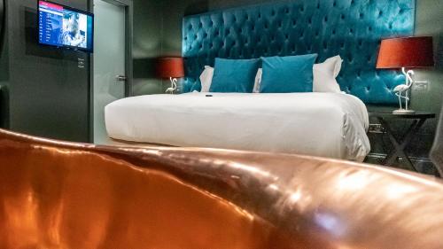 a bedroom with a large bed and a couch at The Hotel Chester in Chester
