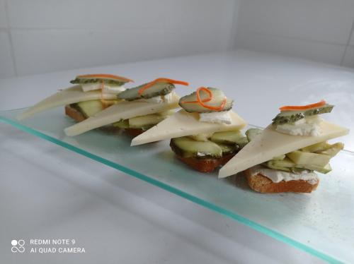 two pieces of bread with crabs on top of it at H La Cabaña in Pozuelo de Alarcón