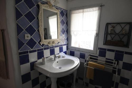 a bathroom with a sink and a mirror at Le Mas Fraissinet in Saint-Jean-de-Valériscle