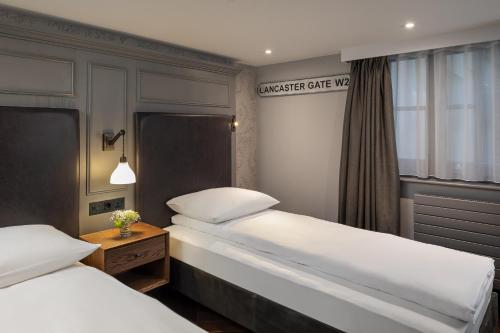 En eller flere senge i et værelse på Hapimag Apartments London