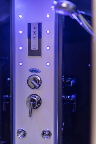 a close up of a machine with buttons on it at GardaBeds Adults Only in Castelnuovo del Garda