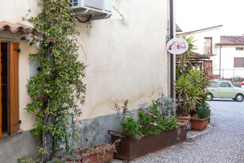 a building with plants on the side of it at GardaBeds Adults Only in Castelnuovo del Garda