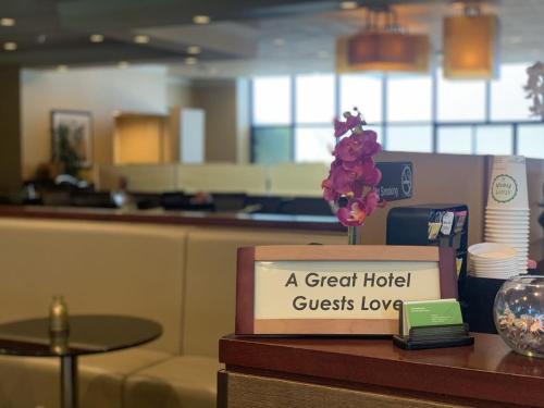 a sign on a counter with a great hotel guests love at Holiday Inn Los Angeles Gateway-Torrance by IHG in Torrance