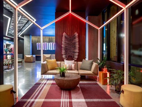 a lobby with two couches and a coffee table at Hyatt Centric Downtown Portland in Portland