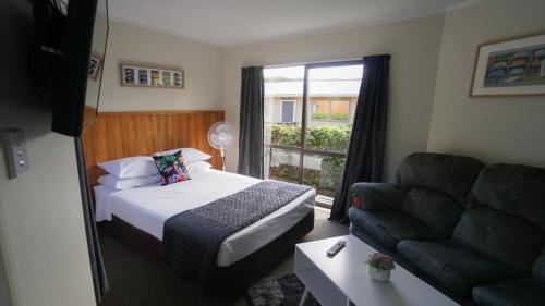 Voodi või voodid majutusasutuse Whangarei Central Holiday Park toas
