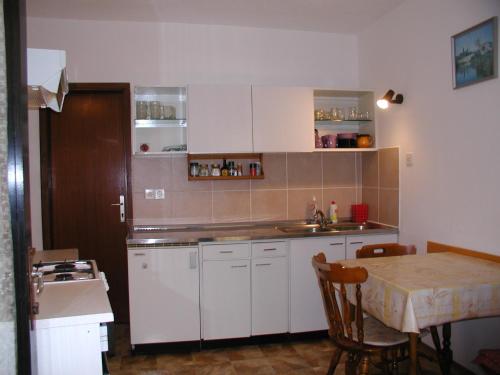 Kuchyň nebo kuchyňský kout v ubytování Rooms Vila Mautner